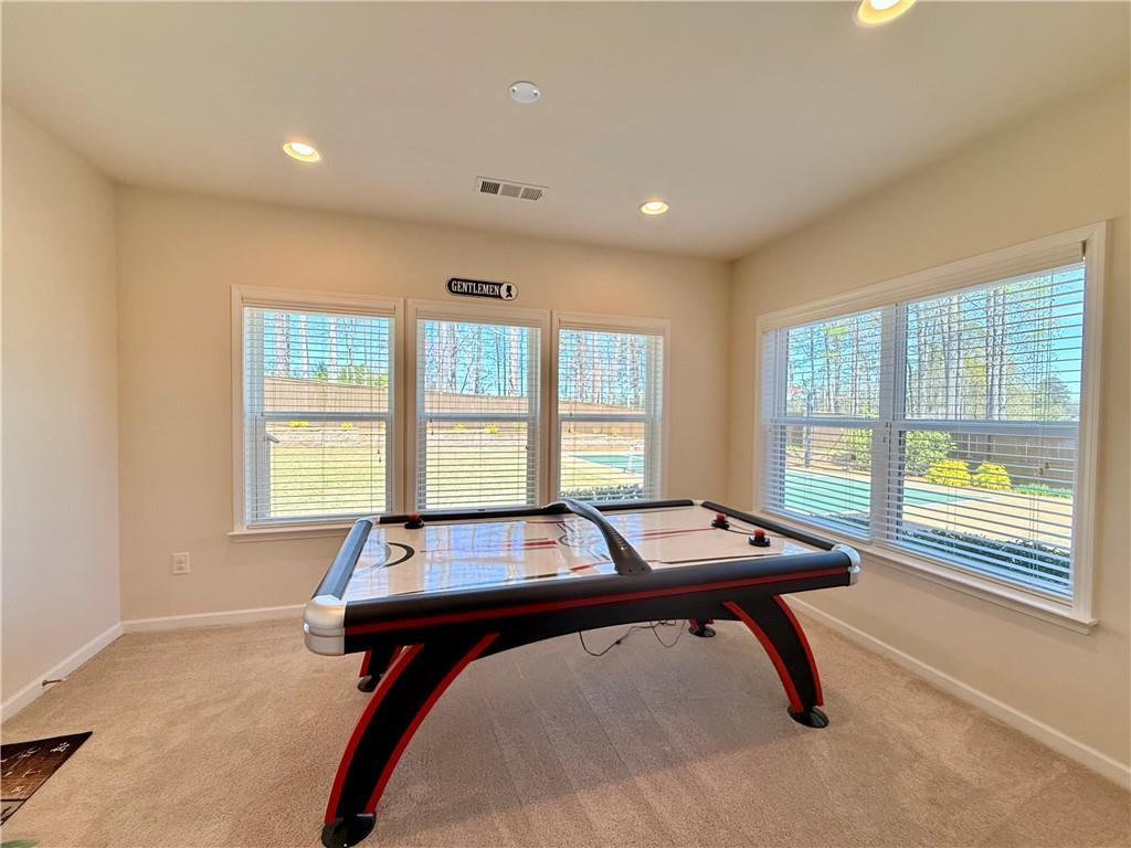 3451 Graham Way Southwest Lilburn, GA 30047 - Photo 37 of 66 a room with pool table and windows