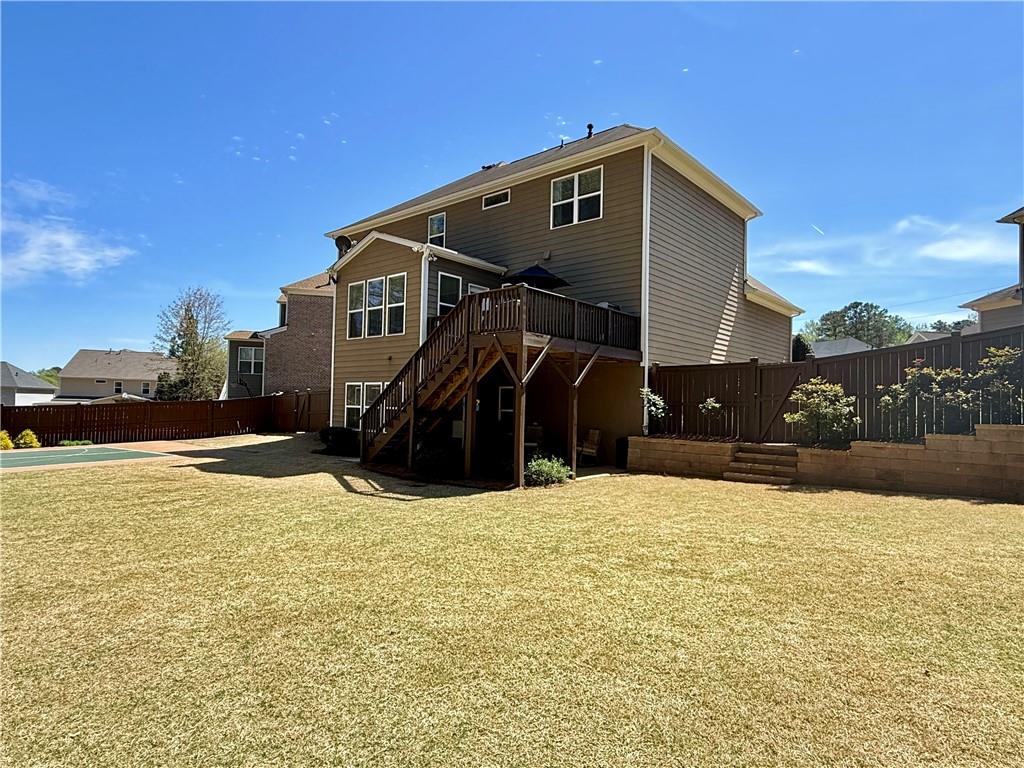 3451 Graham Way Southwest Lilburn, GA 30047 - Photo 61 of 66 a front view of a house with a yard