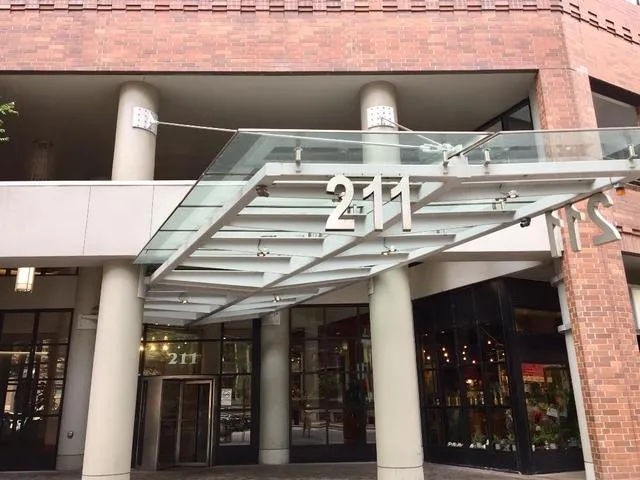 a roof deck with table and chairs