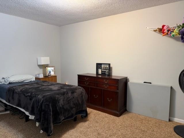 1099 Peyton Ridge Drive Collierville, TN 38017 - Photo 9 of 15 a bedroom with a bed and a dresser