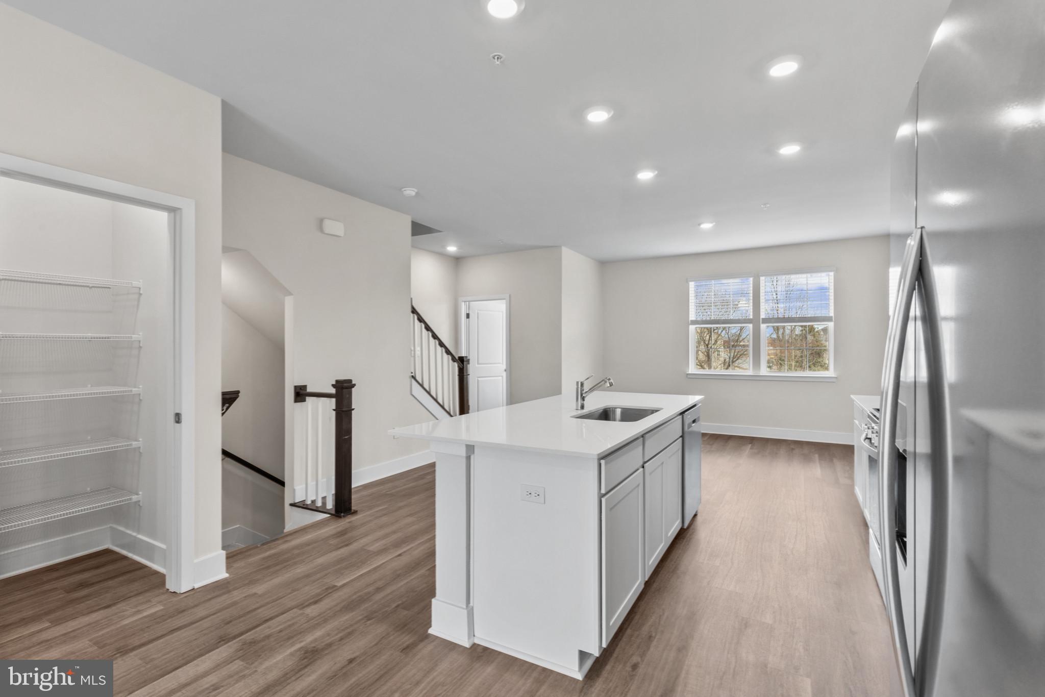 330 Hackley Drive Joppa, MD 21085 - Photo 13 of 32 a kitchen with counter top space and wooden floor