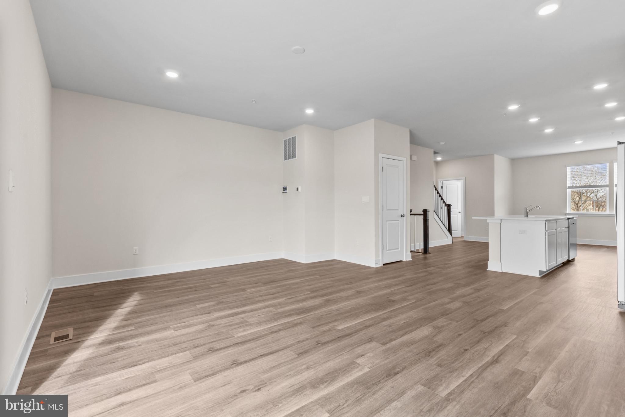 330 Hackley Drive Joppa, MD 21085 - Photo 15 of 32 a view of empty room with wooden floor