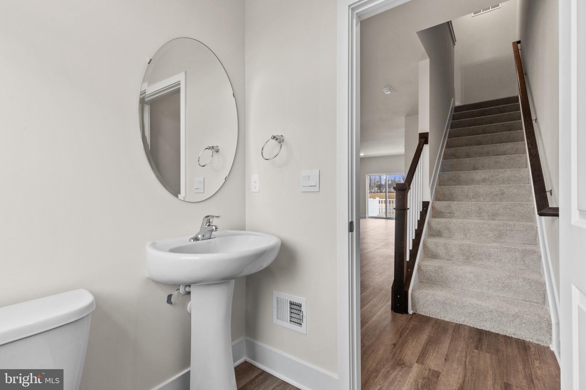 330 Hackley Drive Joppa, MD 21085 - Photo 17 of 32 a bathroom with a sink toilet and a mirror