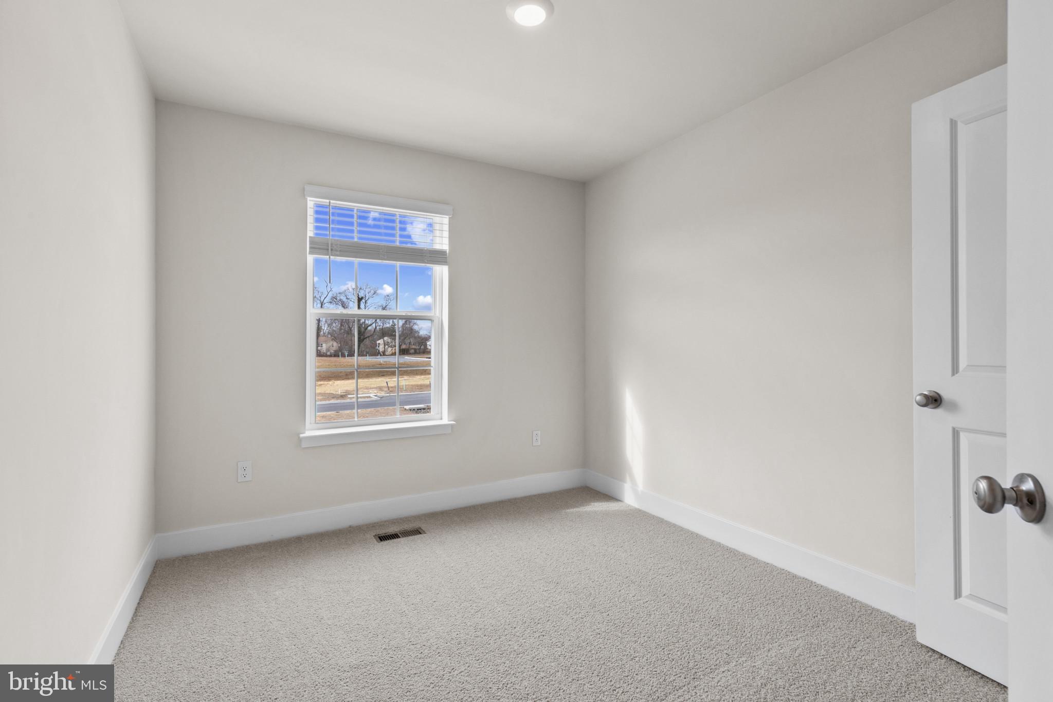 330 Hackley Drive Joppa, MD 21085 - Photo 22 of 32 a view of an empty room with a window
