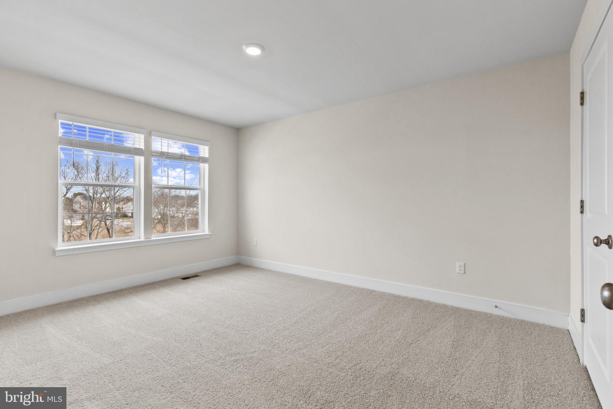 330 Hackley Drive Joppa, MD 21085 - Photo 25 of 32 an empty room with windows