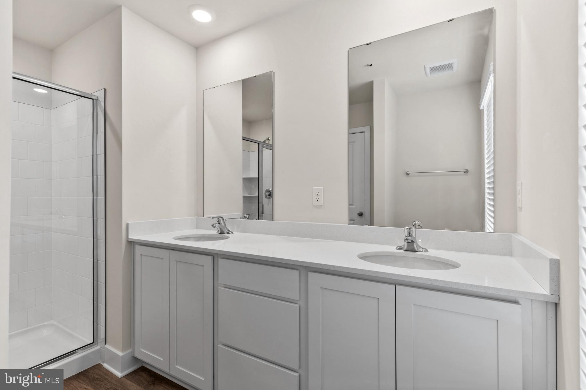 330 Hackley Drive Joppa, MD 21085 - Photo 28 of 32 a bathroom with 2 sink and a mirror