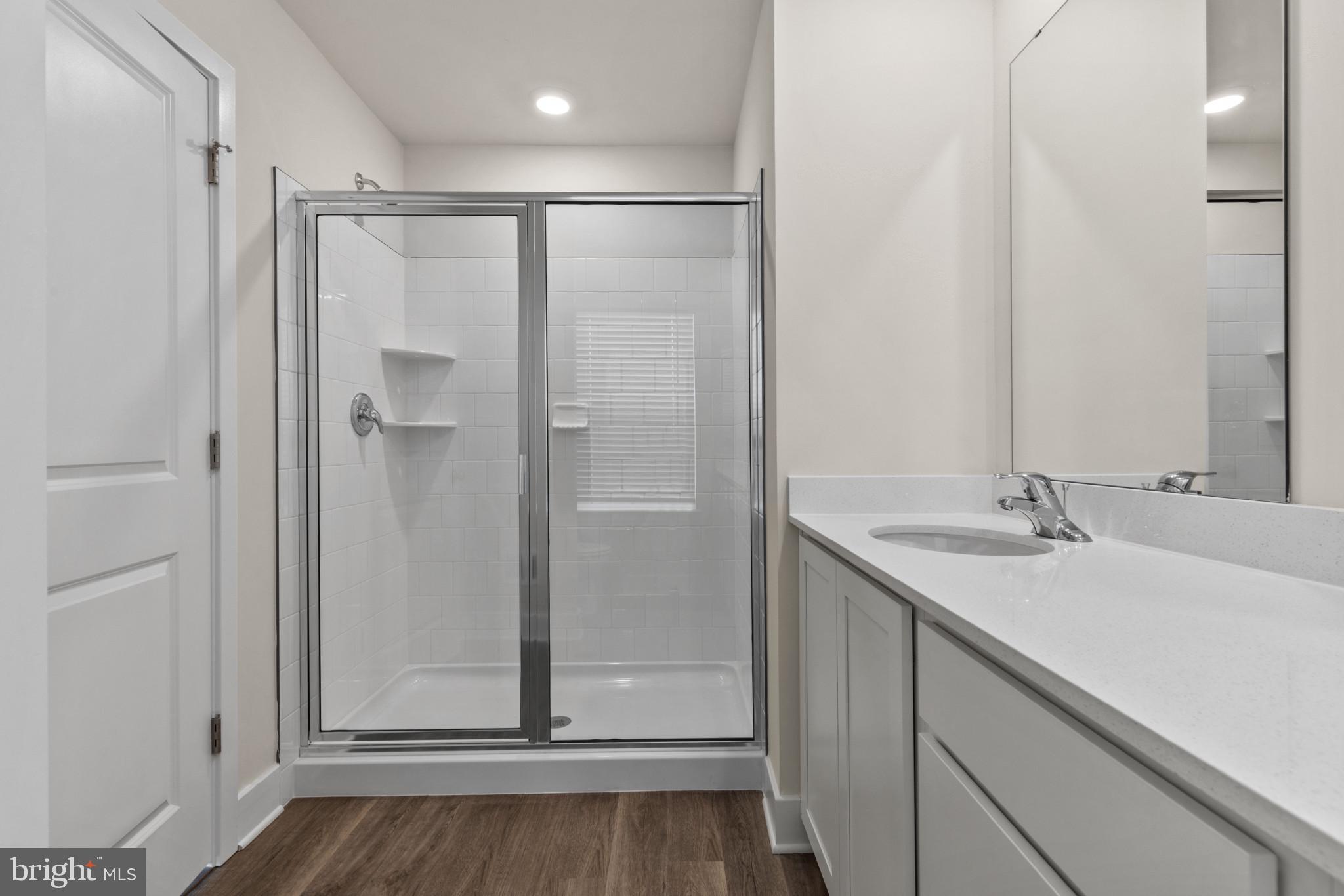 330 Hackley Drive Joppa, MD 21085 - Photo 29 of 32 a bathroom with a sink and a mirror