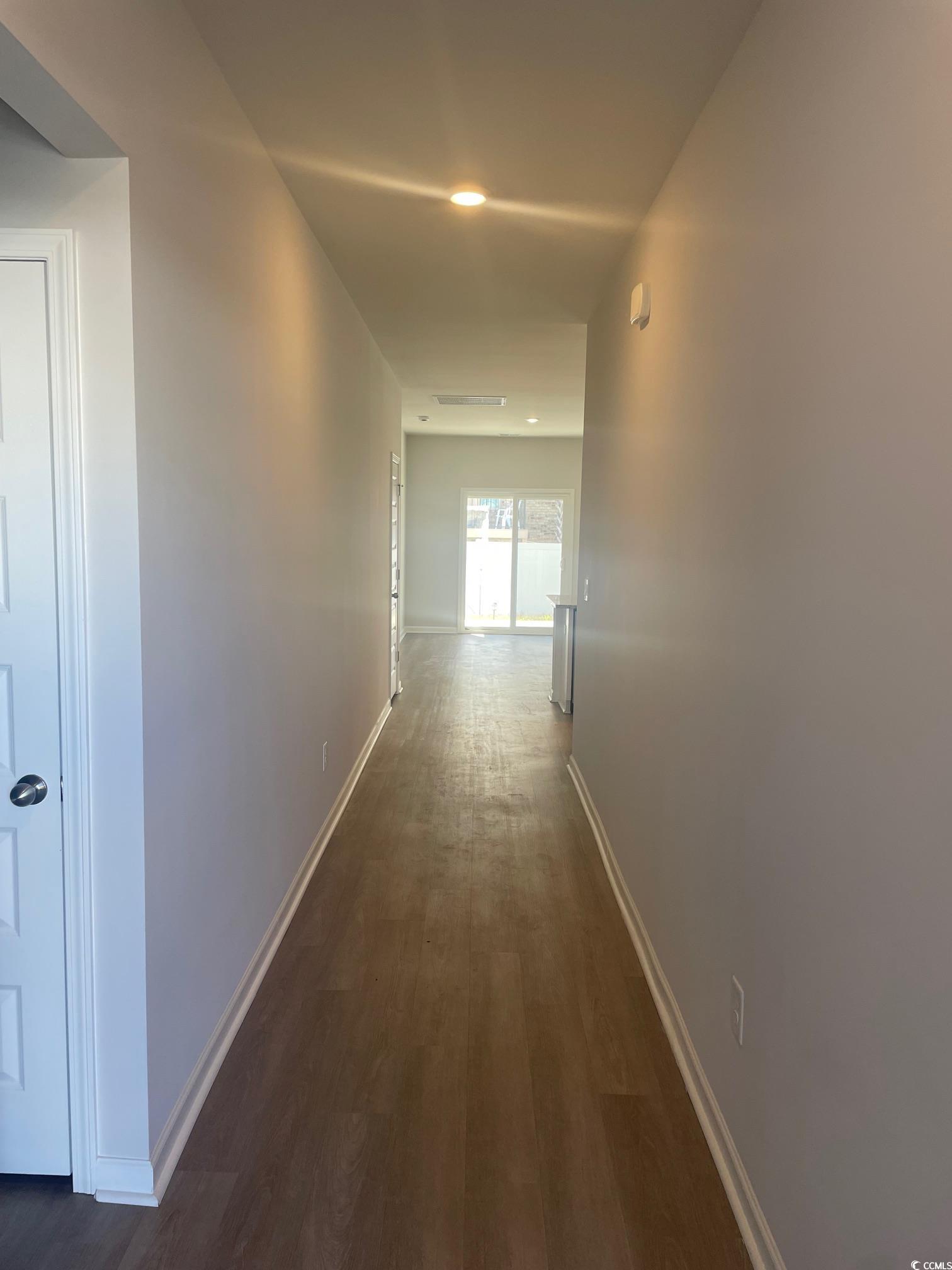 61 S Reindeer Road South Surfside Beach, SC 29575 - Photo 3 of 10 Hallway with dark wood finished floors and recessed lighting