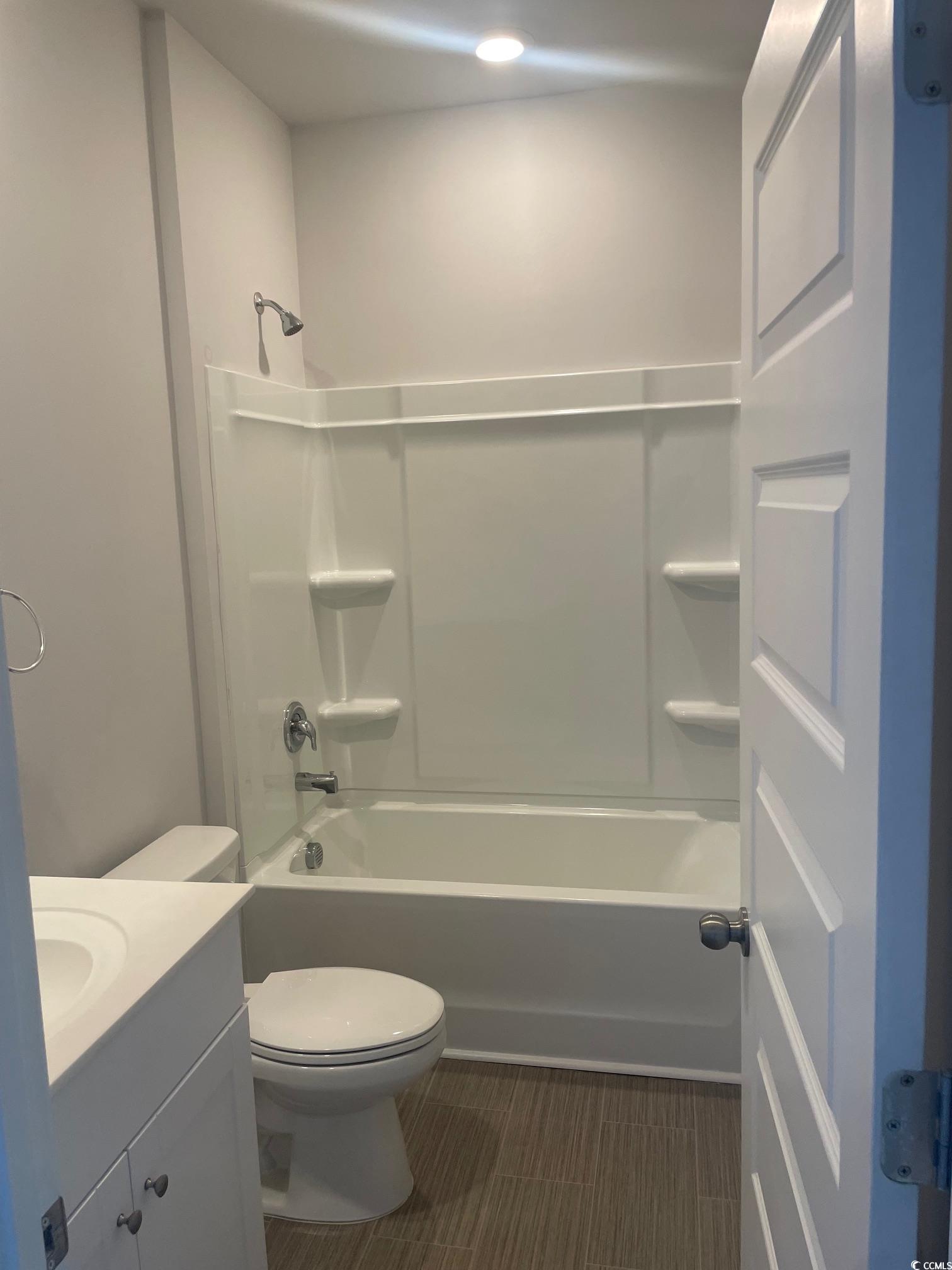 61 S Reindeer Road South Surfside Beach, SC 29575 - Photo 7 of 10 Full bathroom with bathing tub / shower combination and vanity