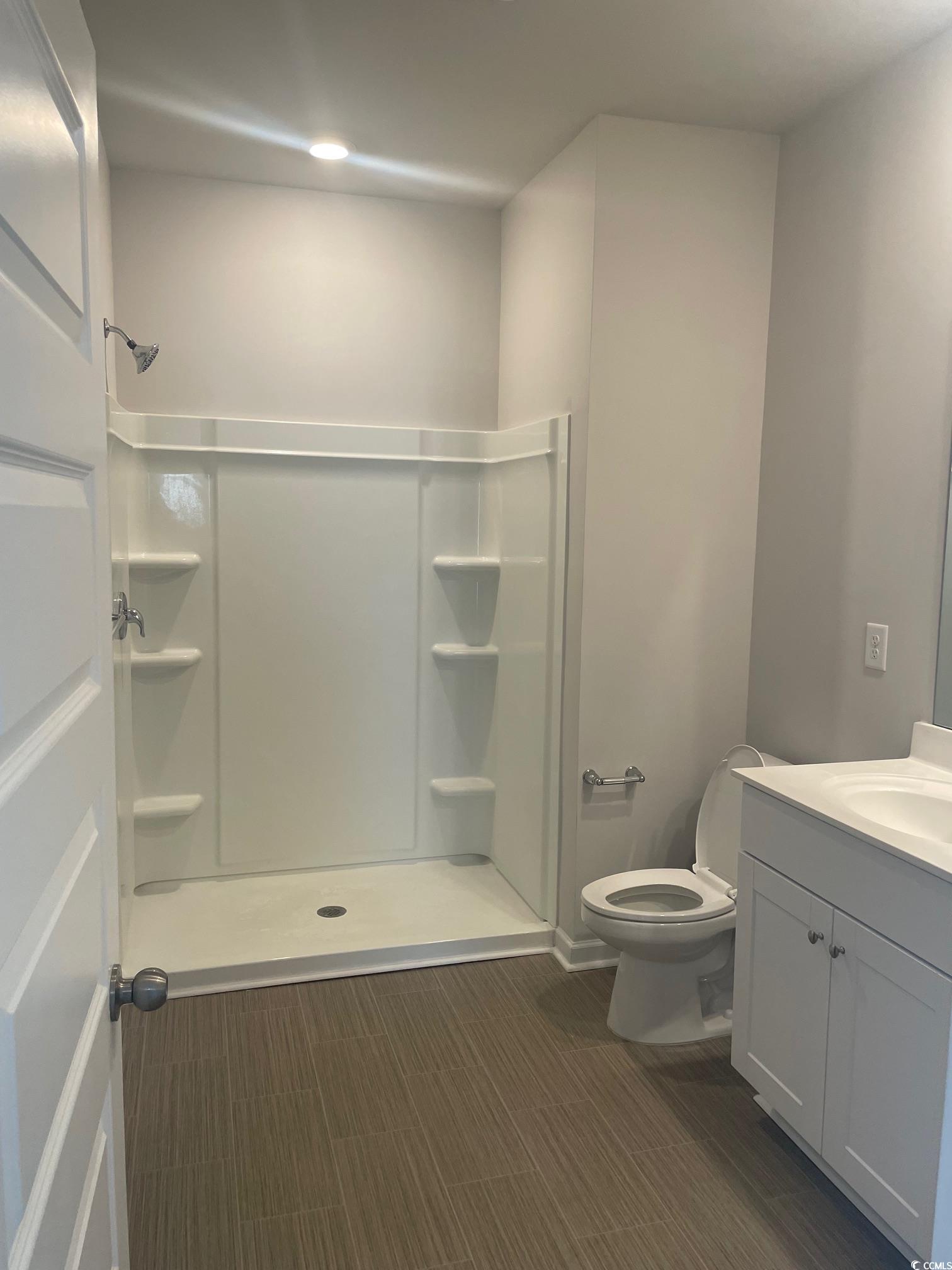 61 S Reindeer Road South Surfside Beach, SC 29575 - Photo 9 of 10 Full bath featuring a stall shower and vanity