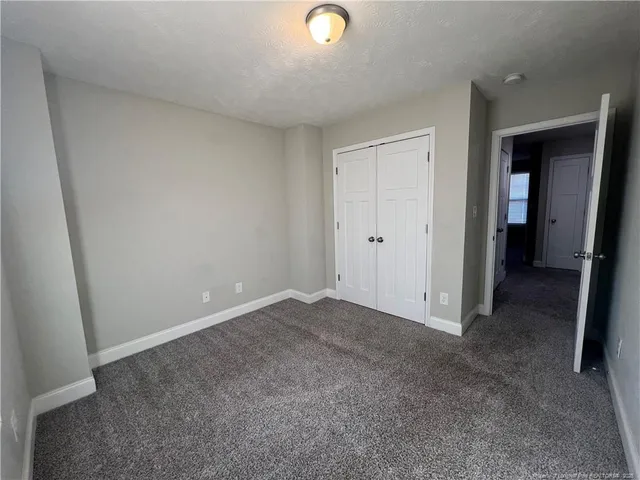 a view of an empty room and closet