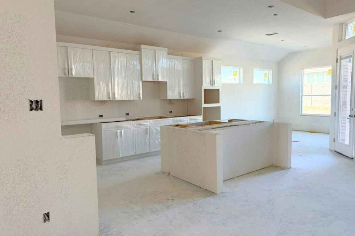 128 Sandrock Trail Georgetown, TX 78633 - Photo 5 of 34 a kitchen with cabinets and window