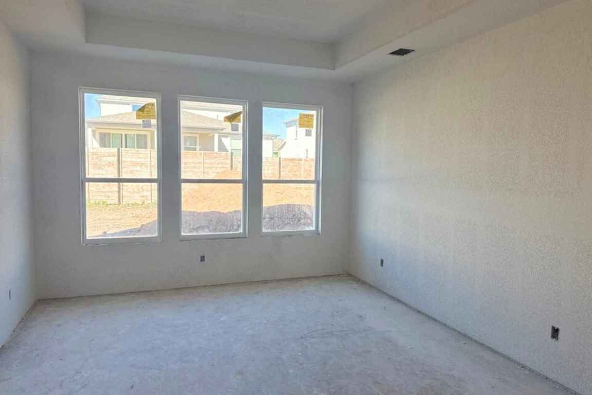 128 Sandrock Trail Georgetown, TX 78633 - Photo 7 of 34 an empty room with a window