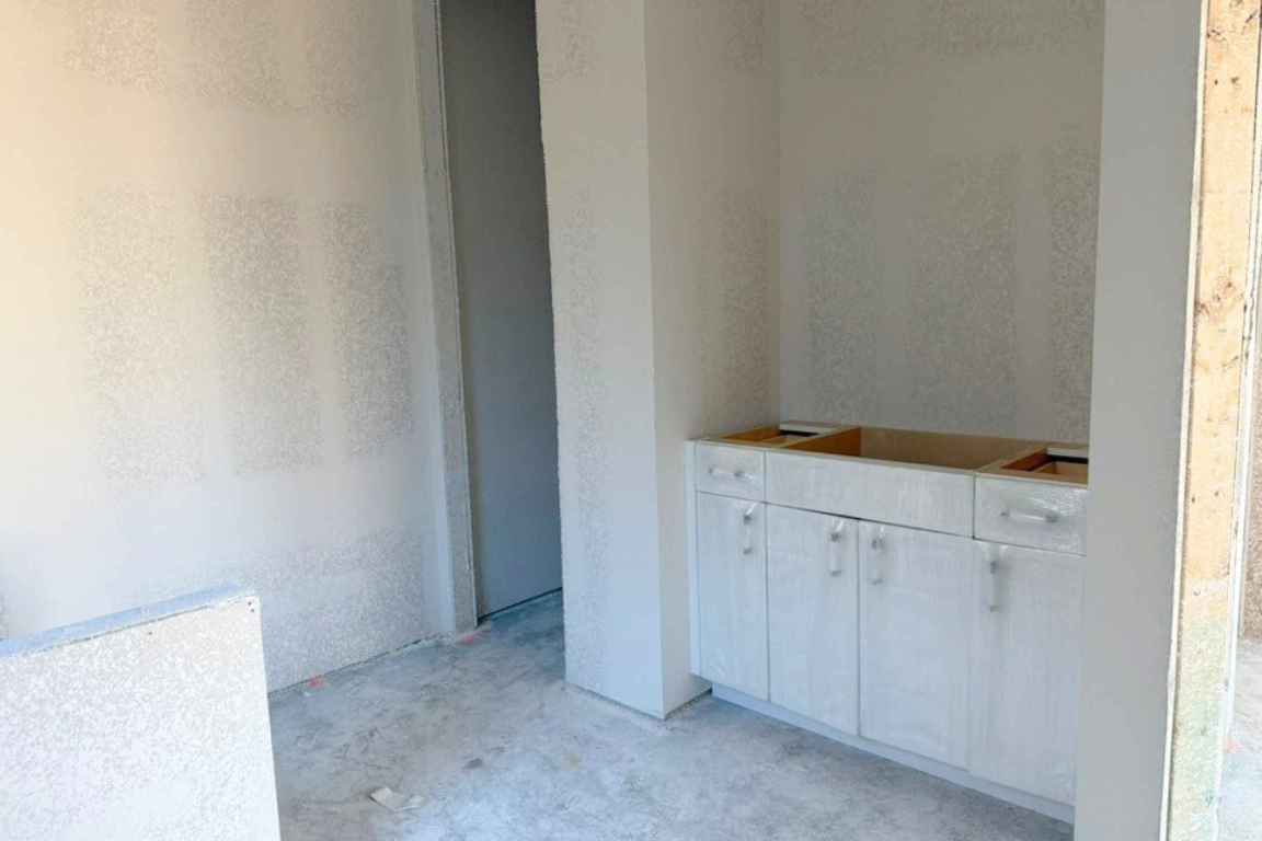 128 Sandrock Trail Georgetown, TX 78633 - Photo 8 of 34 a view of cabinets