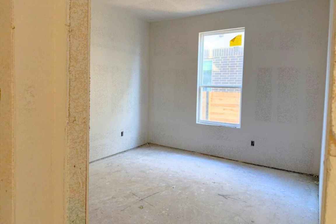 128 Sandrock Trail Georgetown, TX 78633 - Photo 10 of 34 a view of an empty room with a window