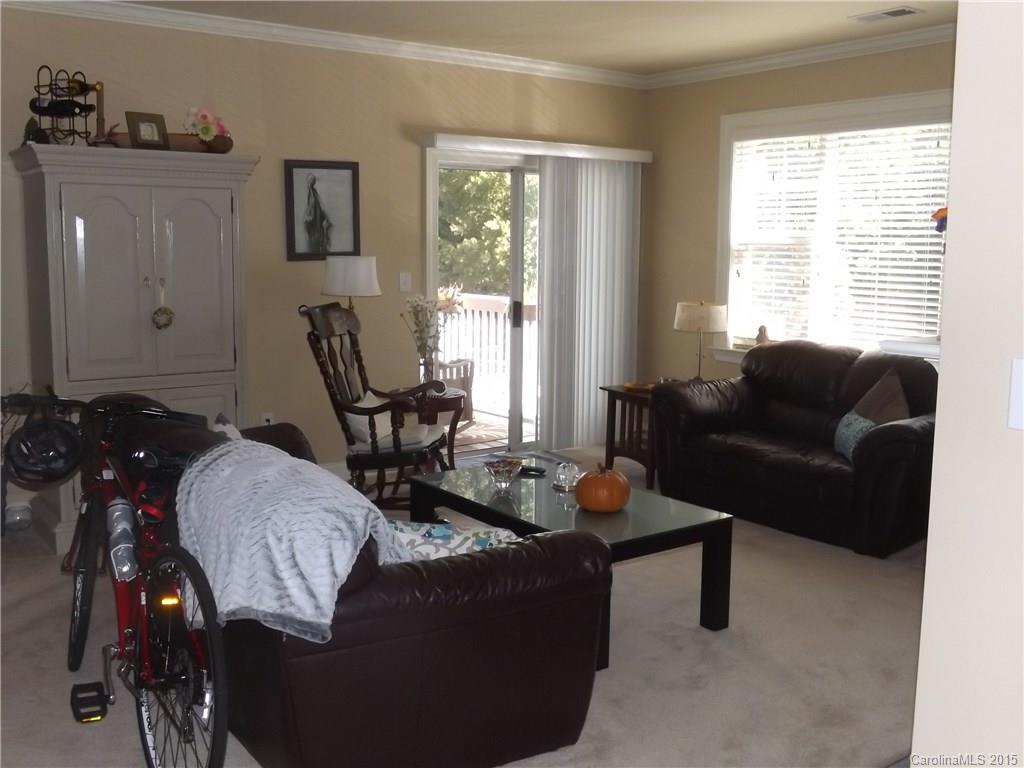 5601 Fairview Road, Unit 9 Charlotte, NC 28209 - Photo 5 of 13 a living room with furniture and a window