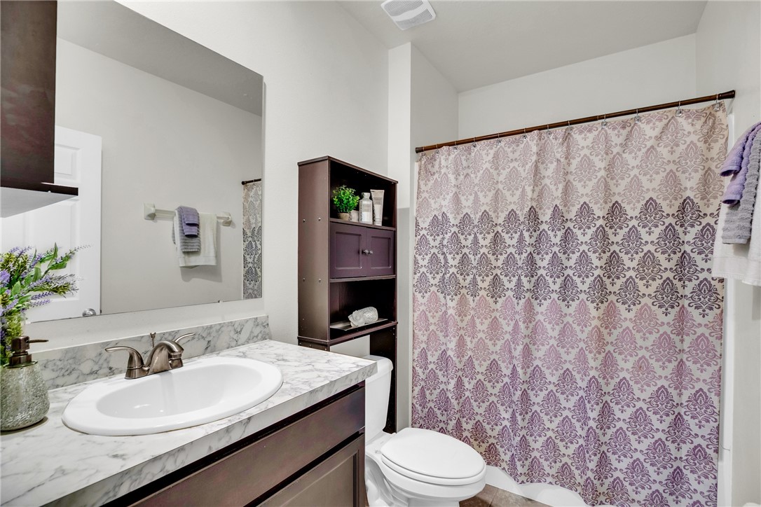 3453 Trinity Circle Fort Pierce, FL 34945 - Photo 20 of 36 a bathroom with a granite countertop sink mirror vanity and toilet