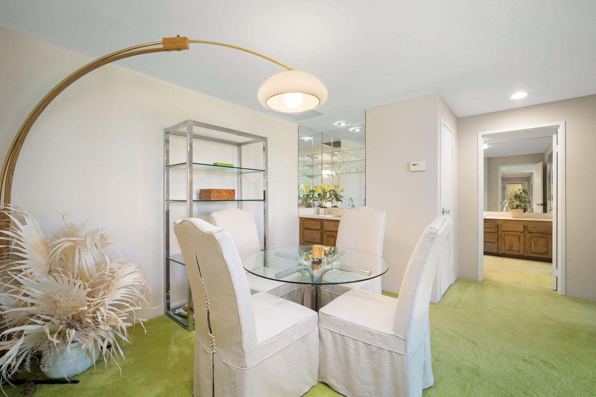 910 Island Drive, Unit 116 Rancho Mirage, CA 92270 - Photo 11 of 39 a dining room with furniture and wooden floor