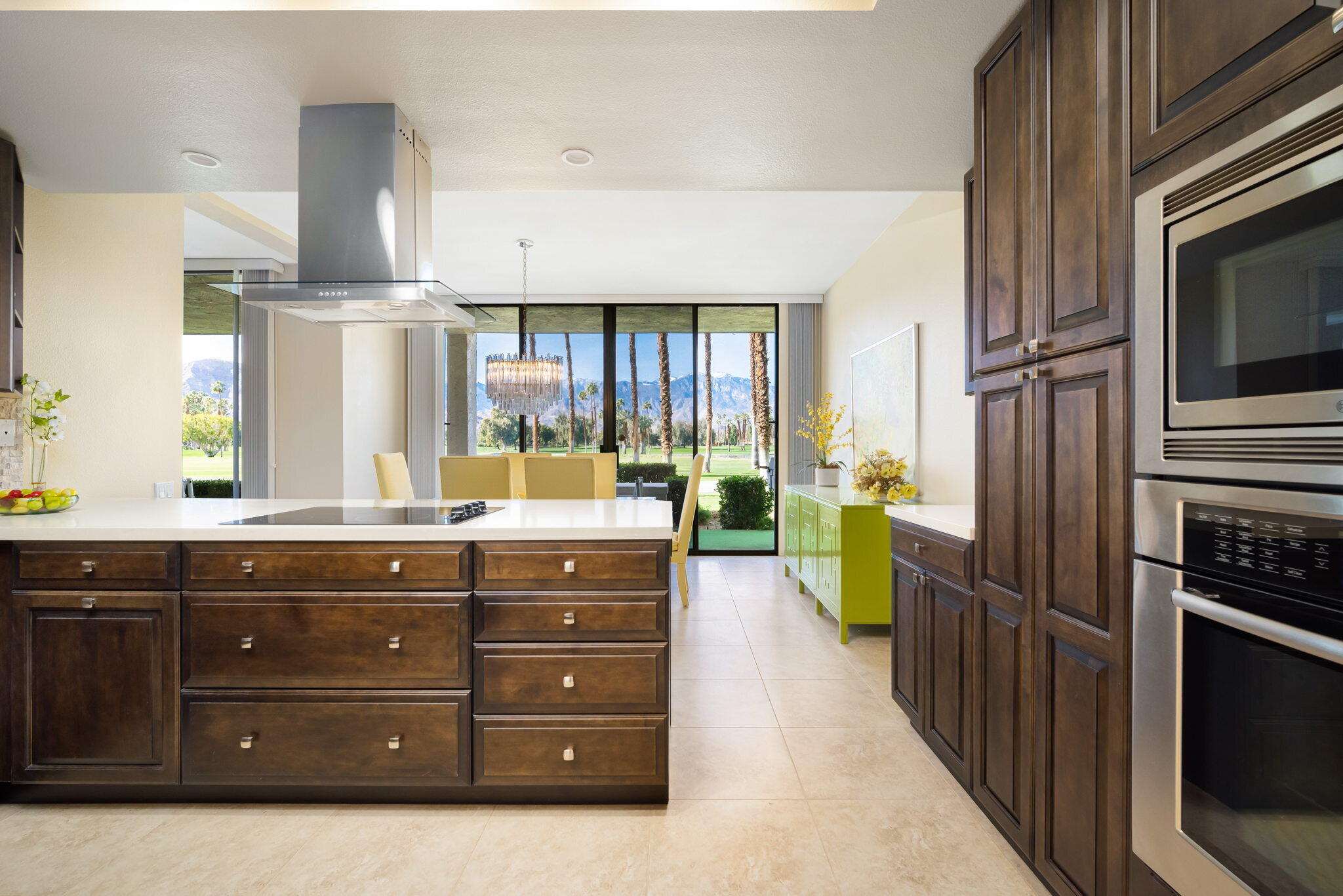 910 Island Drive, Unit 116 Rancho Mirage, CA 92270 - Photo 13 of 39 a kitchen with a sink stove and cabinets
