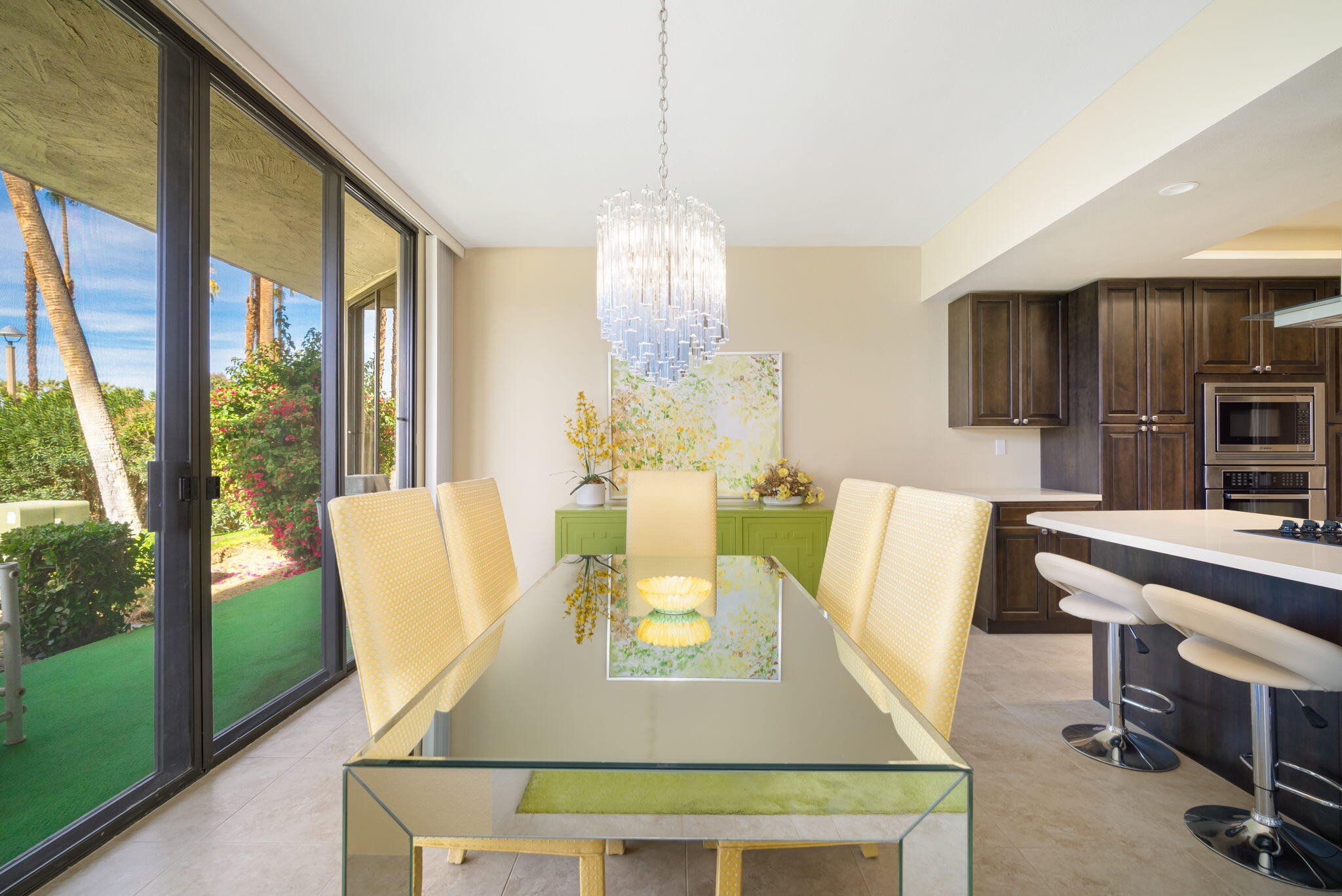 910 Island Drive, Unit 116 Rancho Mirage, CA 92270 - Photo 17 of 39 a view of a dining room with furniture window and outside view
