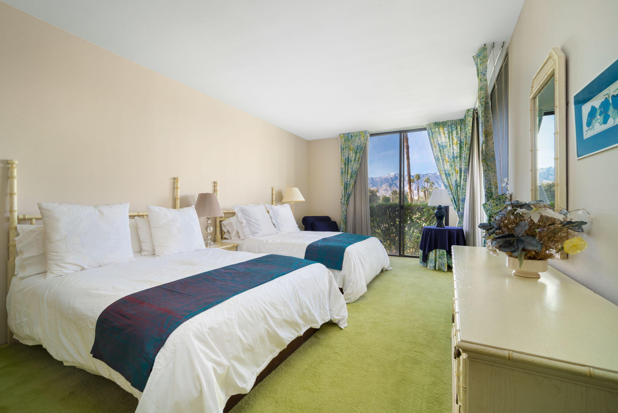 910 Island Drive, Unit 116 Rancho Mirage, CA 92270 - Photo 22 of 39 a bedroom with bed couch and window