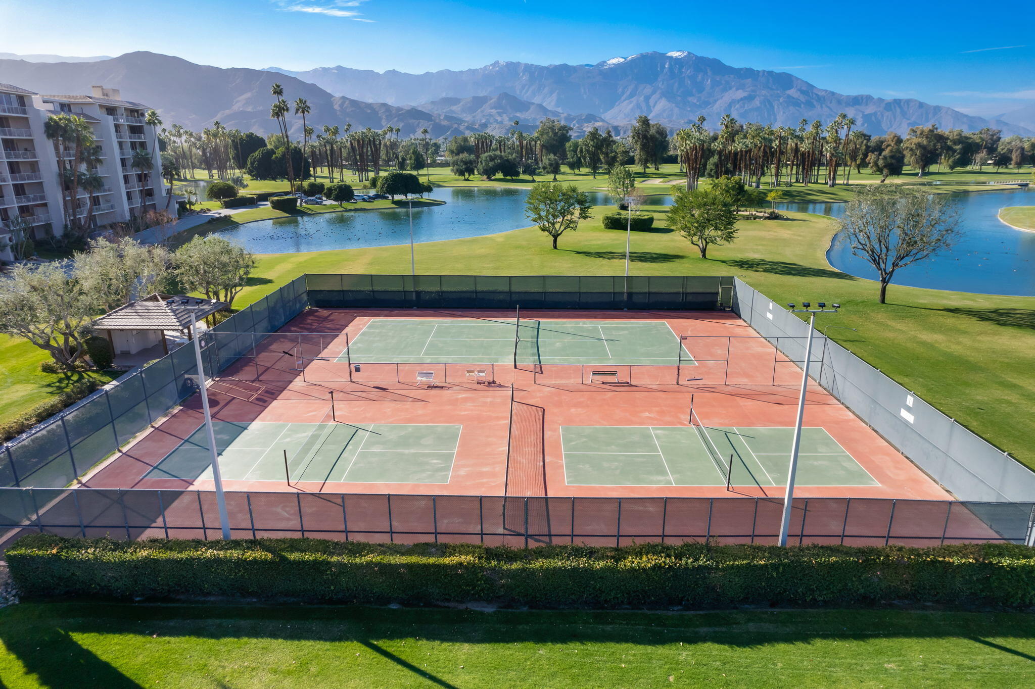 910 Island Drive, Unit 116 Rancho Mirage, CA 92270 - Photo 33 of 39 a view of a lake with a mountain in the background