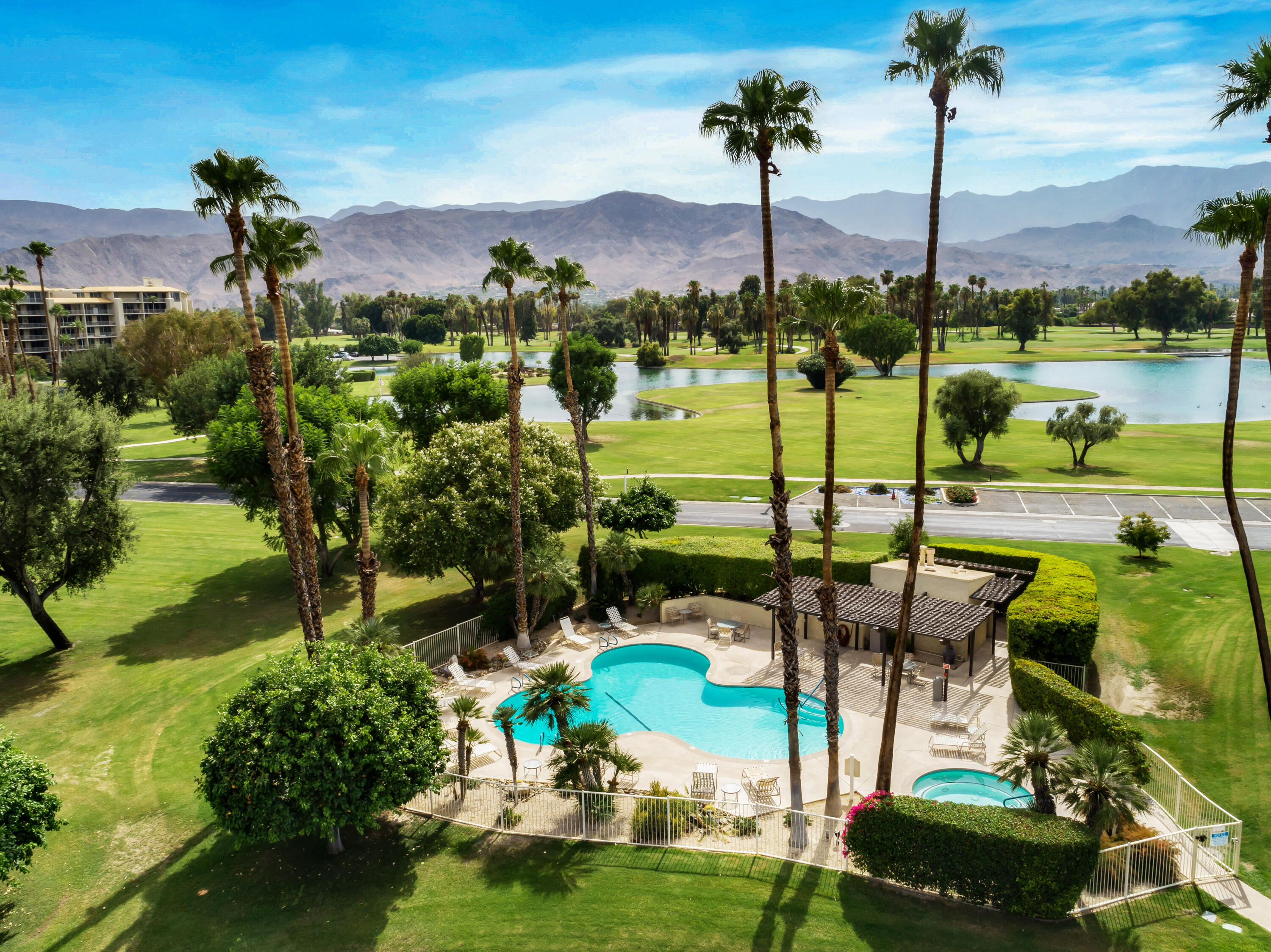910 Island Drive, Unit 116 Rancho Mirage, CA 92270 - Photo 34 of 39 a view of a lake with a table and chairs