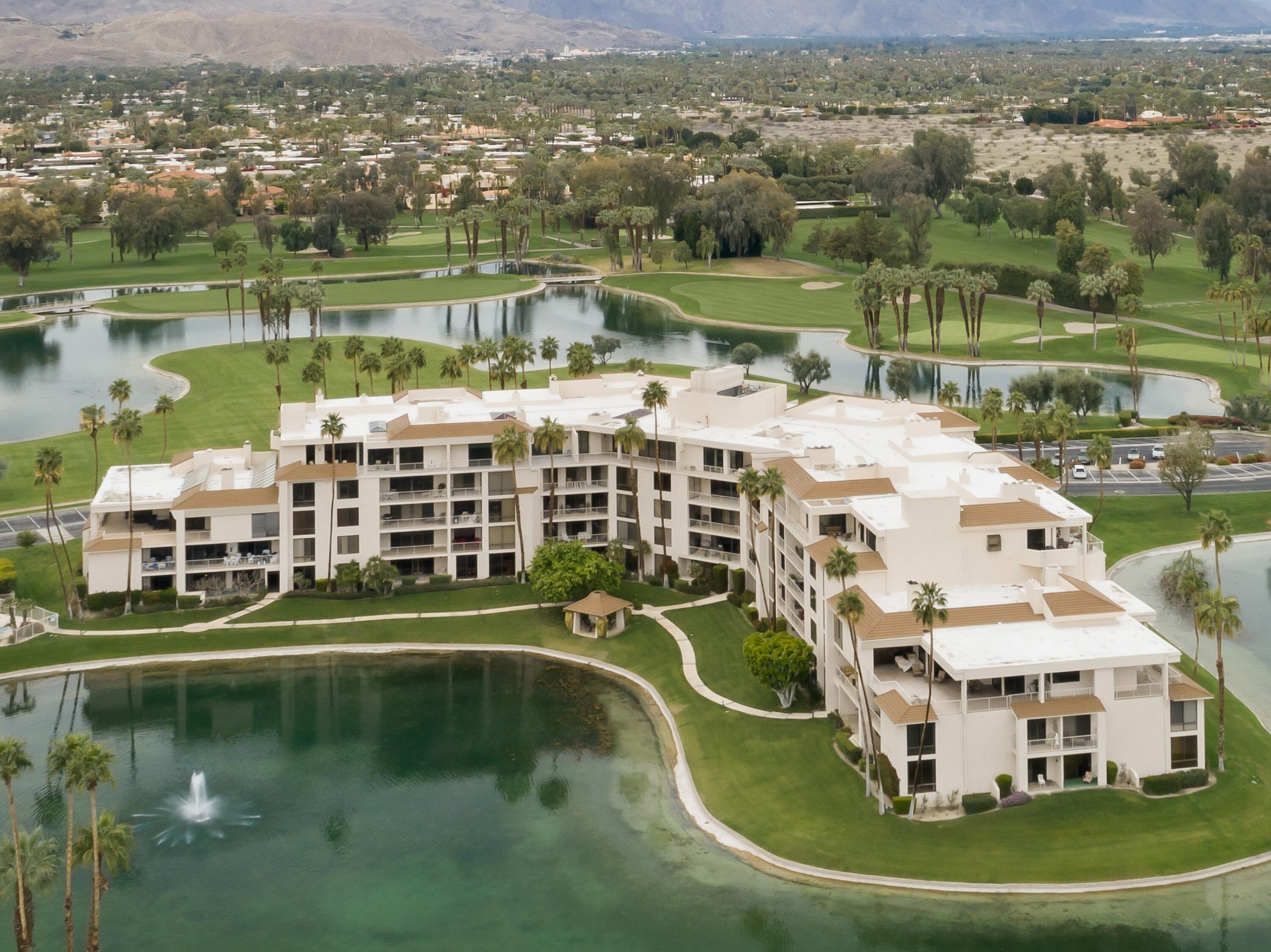 910 Island Drive, Unit 116 Rancho Mirage, CA 92270 - Photo 39 of 39 an aerial view of a house with a lake view
