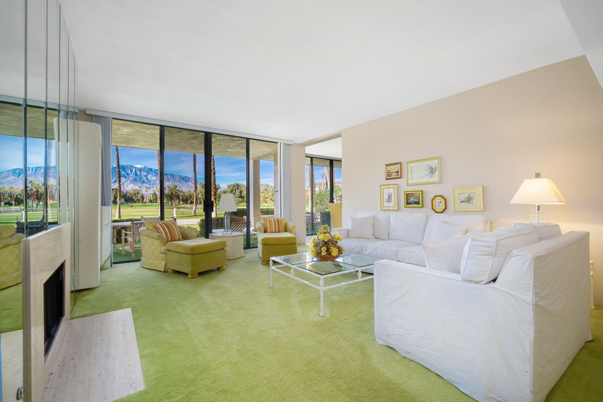 910 Island Drive, Unit 116 Rancho Mirage, CA 92270 - Photo 7 of 39 a living room with furniture and a large window with balcony view