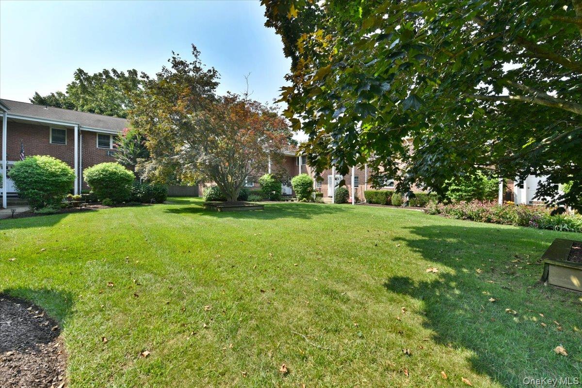 295 Merrick Road, Unit 4A Amityville, NY 11701 - Photo 3 of 16 a view of a trees in front of a house