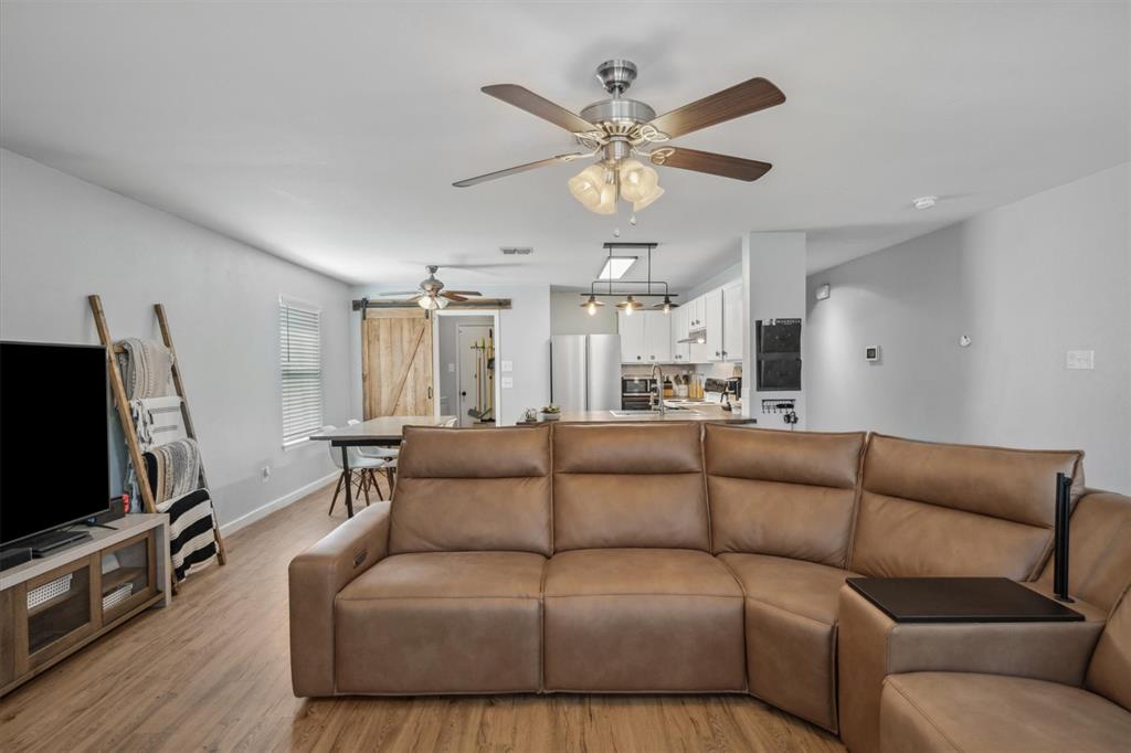 106 Rio Grande Drive Crandall, TX 75114 - Photo 16 of 40 a living room with furniture and a flat screen tv