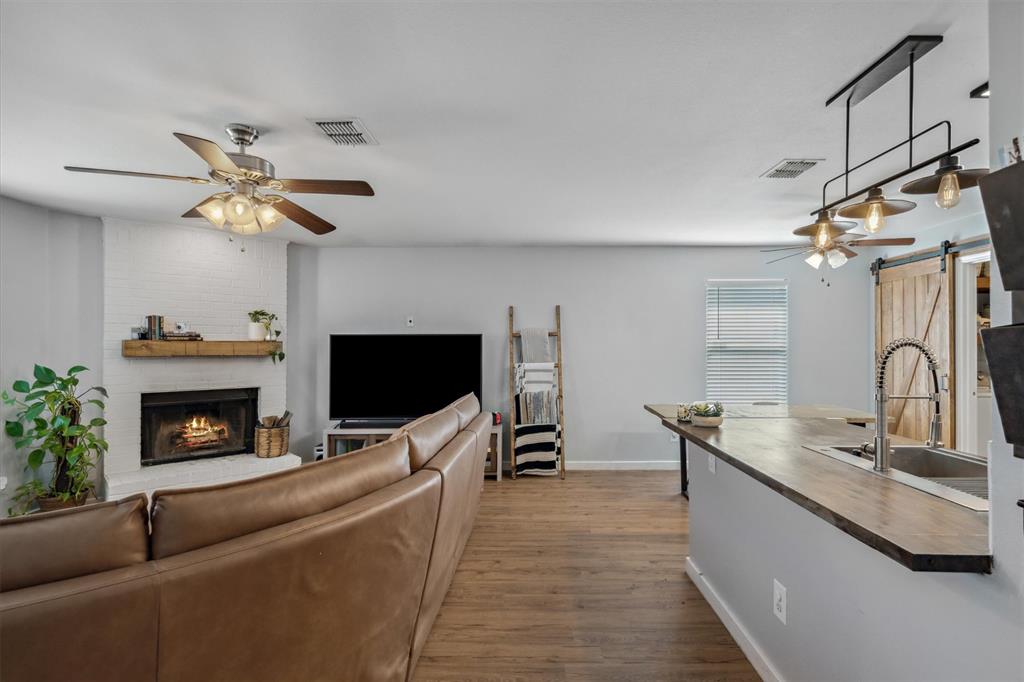 106 Rio Grande Drive Crandall, TX 75114 - Photo 17 of 40 a living room with furniture and a fireplace