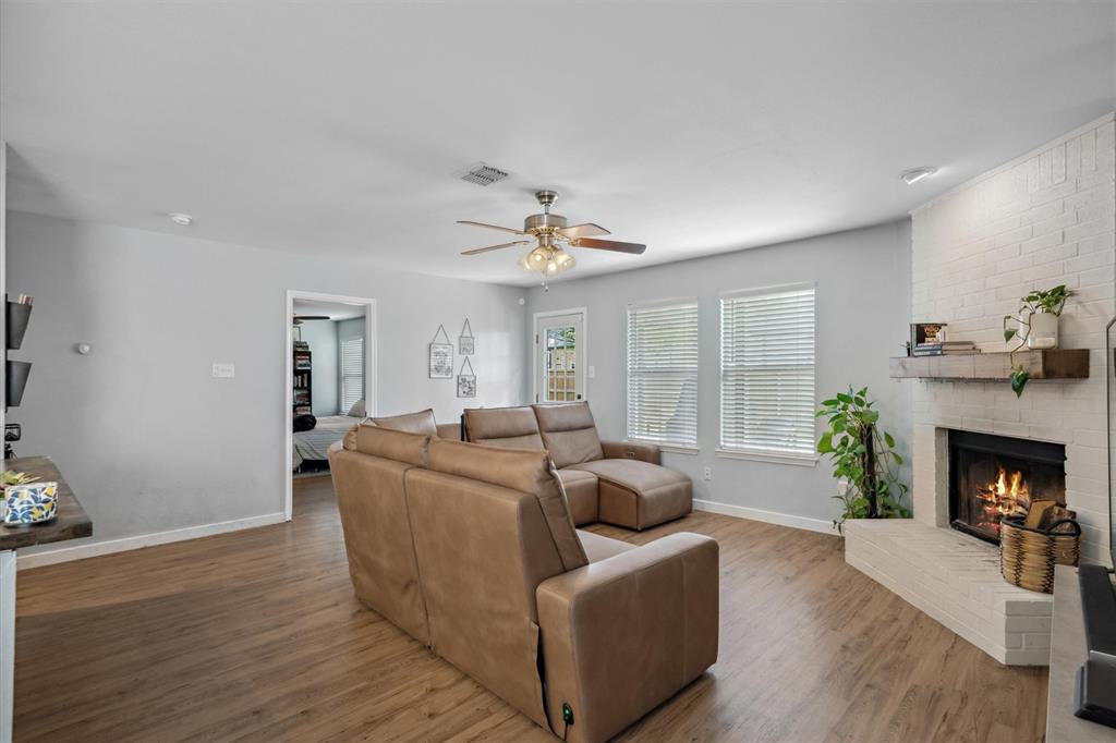 106 Rio Grande Drive Crandall, TX 75114 - Photo 18 of 40 a living room with furniture and a fireplace
