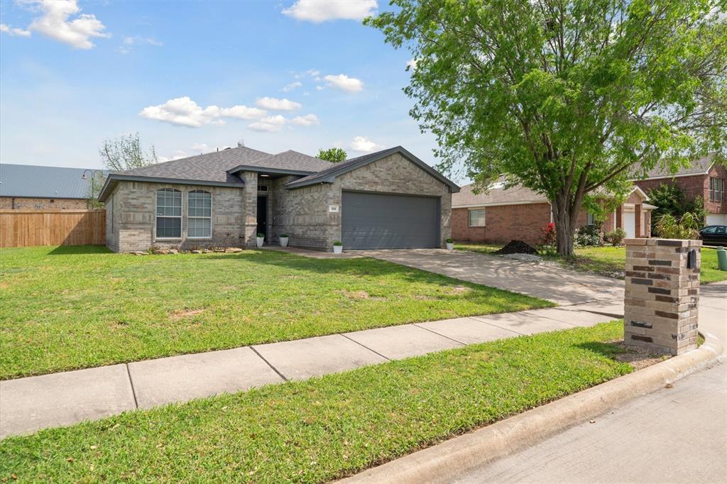 106 Rio Grande Drive Crandall, TX 75114 - Photo 2 of 40 a view of a house with a yard and large tree