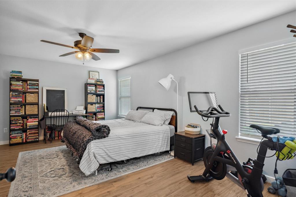 106 Rio Grande Drive Crandall, TX 75114 - Photo 22 of 40 a bedroom with a bed furniture and a flat tv screen