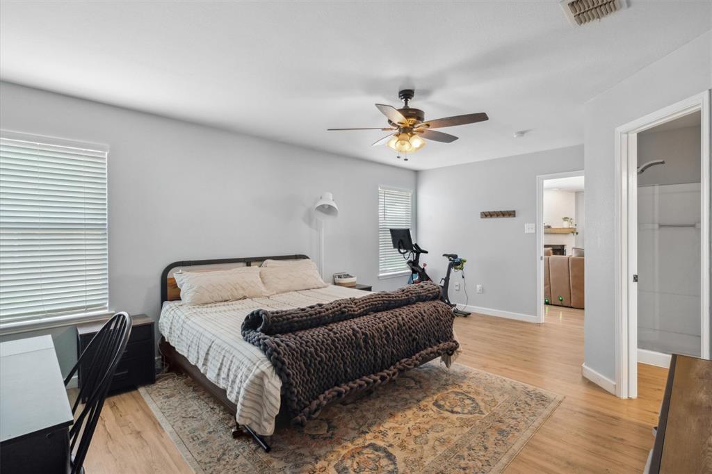 106 Rio Grande Drive Crandall, TX 75114 - Photo 24 of 40 a bed room with a bed and a chandelier