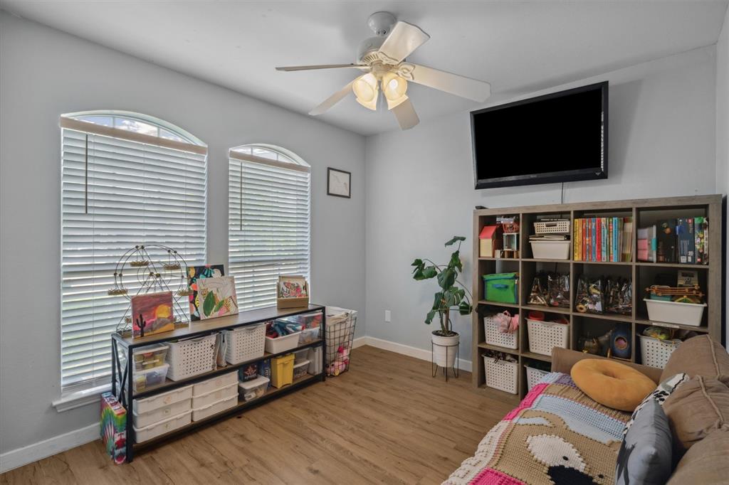 106 Rio Grande Drive Crandall, TX 75114 - Photo 29 of 40 a living room with furniture and a flat screen tv