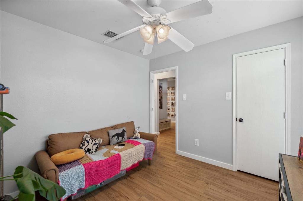 106 Rio Grande Drive Crandall, TX 75114 - Photo 30 of 40 a living room with furniture and a wooden floor
