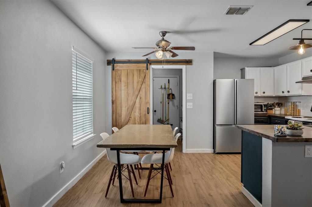 106 Rio Grande Drive Crandall, TX 75114 - Photo 9 of 40 a kitchen with stainless steel appliances a refrigerator and a stove top oven