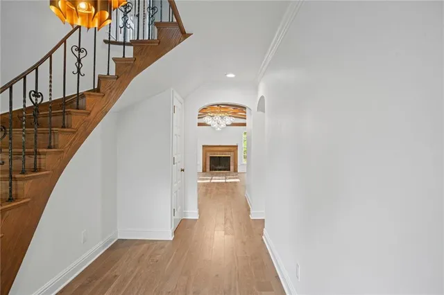 a view of hallway with wooden floor