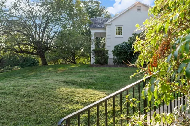 a view of a house with a backyard