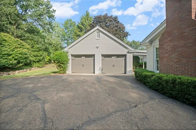 a view of a house with a yard and garage