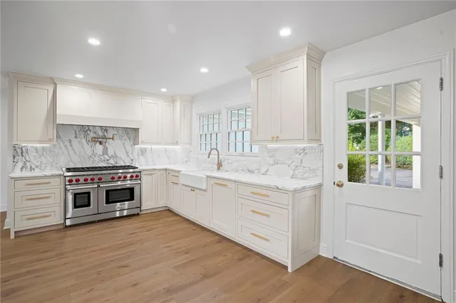 a large kitchen with a stove top oven