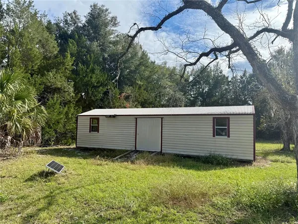 an empty room with a empty space and windows