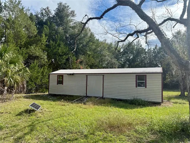an empty room with a empty space and windows