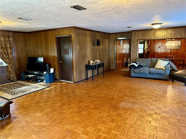 a view of a livingroom with a fireplace and window