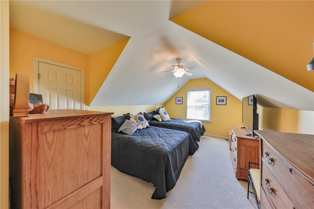63 Long Road Lenhartsville, PA 19534 - Photo 81 of 100 Angled ceilings frame this spacious upper-level bedroom finished with wall-to-wall carpeting.