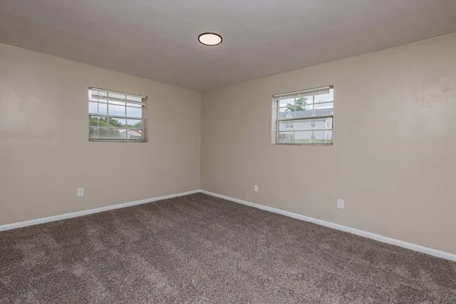 an empty room with windows