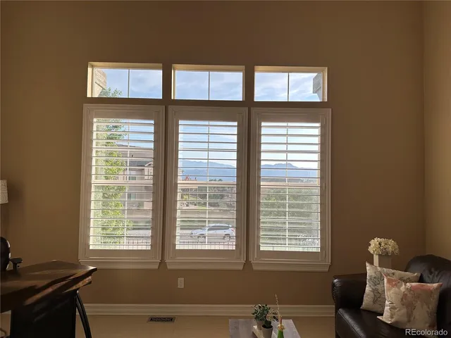 a living room with furniture and windows