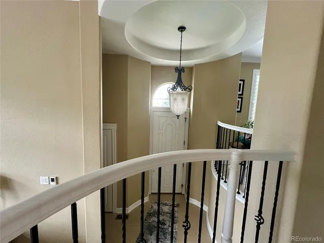 a view of a hallway with a chandelier